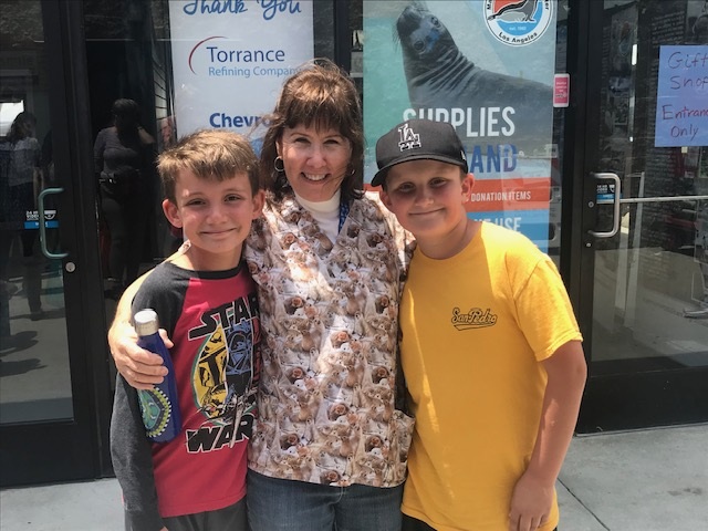 Lori Olsen with boys at mammal care center