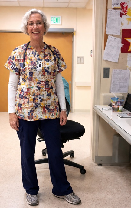 woman smiling happy in her patriotic print scrub top