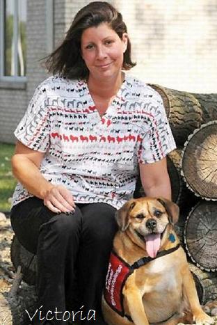 woman seated on log with dog wearing rescue animal print scrubs