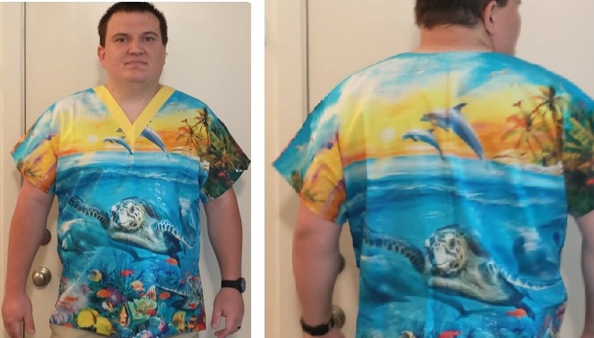 man showing front and back of a scrub top with a sea turtle