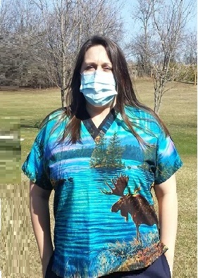 Nurse in Canada wearing a moose scrub top in nature