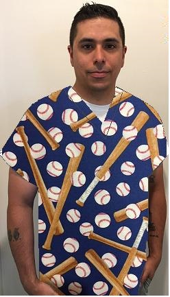 man wearing blue baseball print scrub top