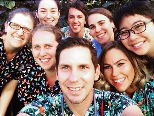 veterinarian and vet techs wearing scrub tops