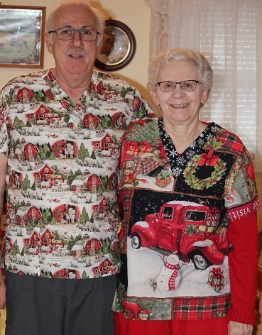 Canaadian couple wearing their new holiday Christmas scrub top shirts