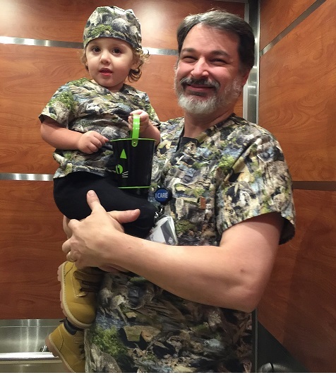 boy and his grandpa wearing matching scrub top uniforms