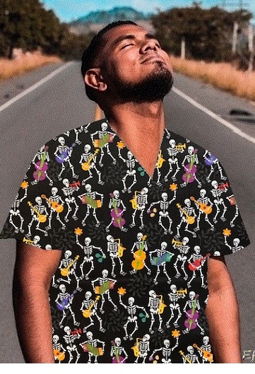 man standing in road with a skeleton print scrub top on