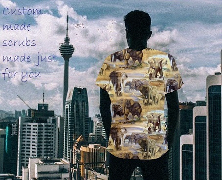 man wearing printed scrub top looking out at city