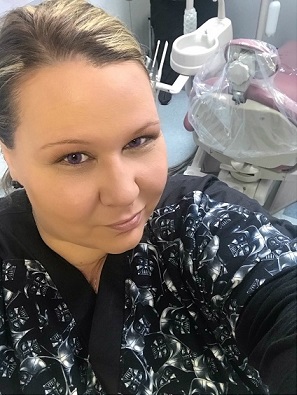 dental assistant wearing dental scrubs that are custom made