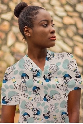 girl wearing veterinary print scrub top with dogs