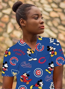 girl wearing an MLB Cubs print scrub top in blue cotton